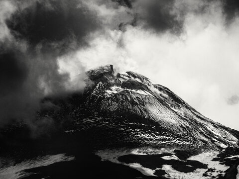 Summit Crater of Mount Etna with Dramatic Clouds in Black and White