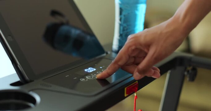 Close up morning routine, athlete and workout on machine for weight loss, healthy body or training.