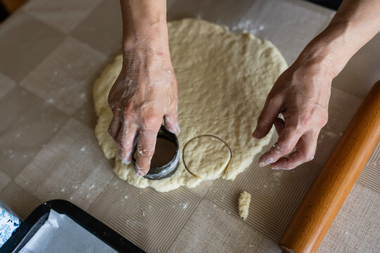 The housewife kneads and makes the scones in the traditional way according to an old recipe.