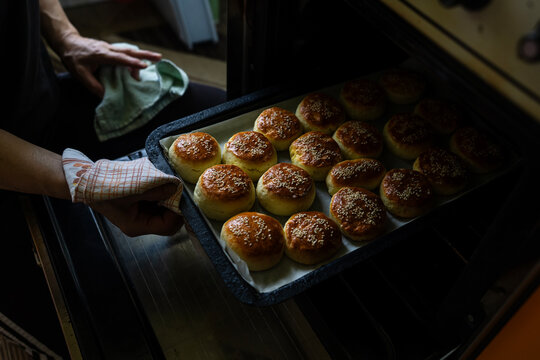 The housewife kneads and makes the scones in the traditional way according to an old recipe.