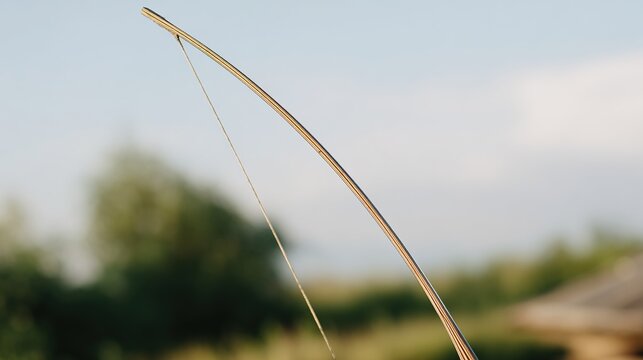 archer. A traditional longbow fully drawn, taut string against a soft natural background. event key visuals, club posters, designed for fitness apps and gym onboarding, boosts motivation.