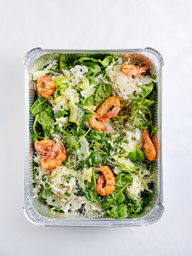 Shrimp and spinach salad with parmesan cheese, meal prep container for healthy eating concept