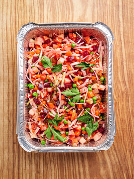 Colorful mixed vegetable salad with ham and peas, catering menu concept, healthy meal prep for gatherings