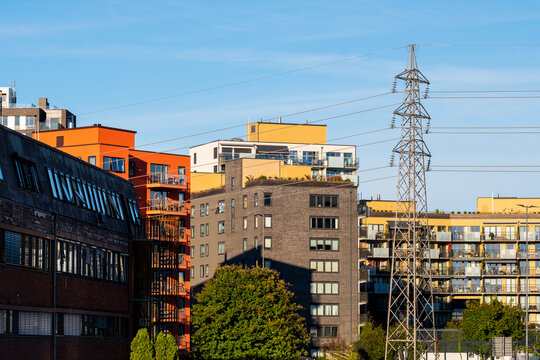 Urban skyline in Oslo, Norway layers apartment buildings, power lines, facades, balconies, windows and residential architecture in clear light