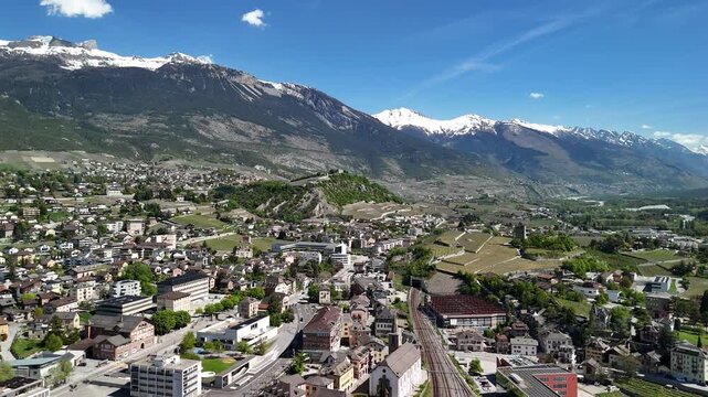 City of Sion located in the Rh&ocirc;ne valley in Switzerland, aerial drone Swiss Europe
