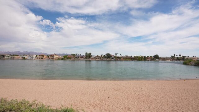 Empty Beach on Colorado River Big Bend With Laughlin Town in Background, Nevada USA