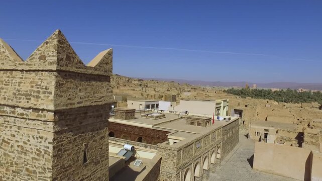 Historic Stone Tower in Traditional Desert Village Architecture

