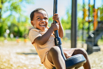 Happy young american child on playground this summer season © Louis-Paul Photo