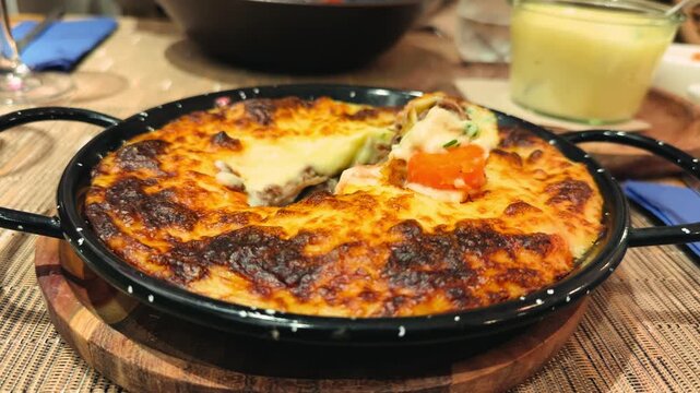 French style duck and potato casserole topped with melted cheese. Classic hachis parmentier with tender duck meat, creamy mashed potatoes, and crispy golden crust. High quality 4k footage