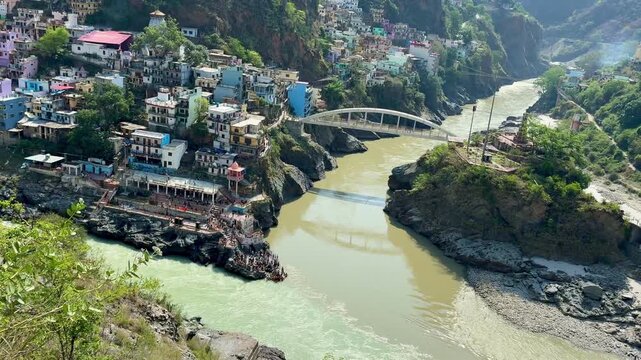 Wide-angle landscape of Devprayag where the Alaknanda and Bhagirathi rivers unite to form the Ganges.