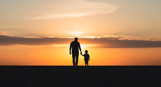 Happy fathers day silhouette of father and son walking at sunset