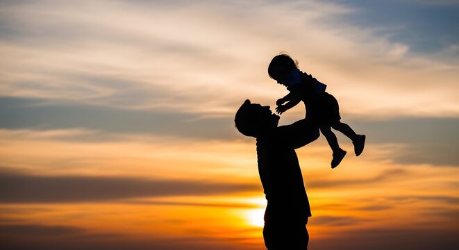 Happy fathers day silhouette of dad lifting son at sunset