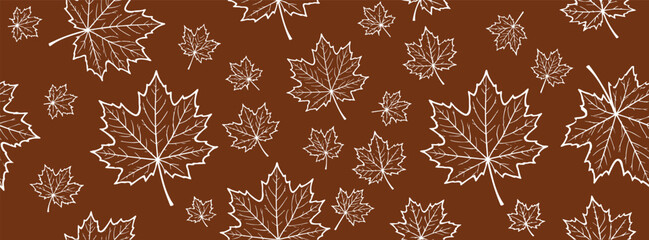 Seamless pattern with white maple leaves on a brown background © Zbrake Studio