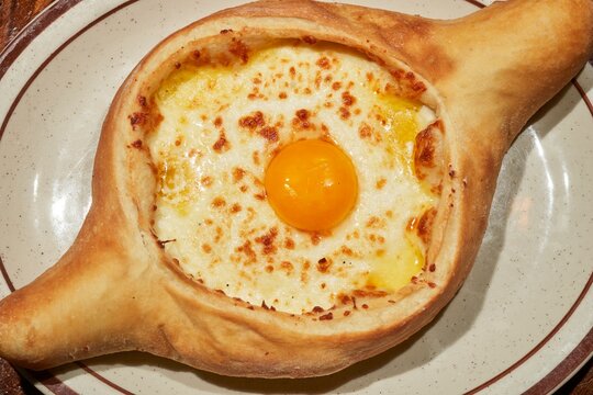 An Acharuli khachapuri, the classic bread with egg and cheeese from the Republic of Georgia as served at the Kavkaz restaurant in Loganton, Pennsylvania, USA.