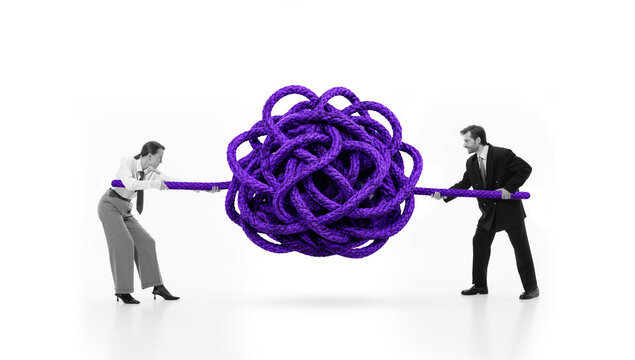 Business partners pulling purple tangled rope in problem solving metaphor. Concept of conflict resolution, complex challenge, negotiation, teamwork and crisis management.