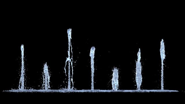 Isolated Line of 7 Tiny Trickle Fountains rising straight upwards on a black background
