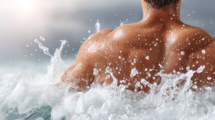 Fototapeta premium Man Enjoying a Refreshing Swim in a Turbulent Ocean Environment