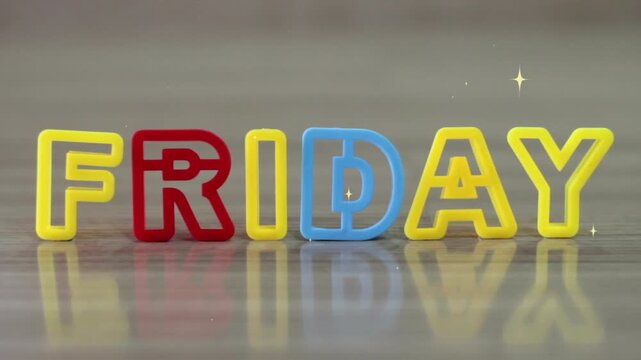 Friday letters formed by colorful plastic blocks sit on a smooth wooden surface to mark the end of the work week.