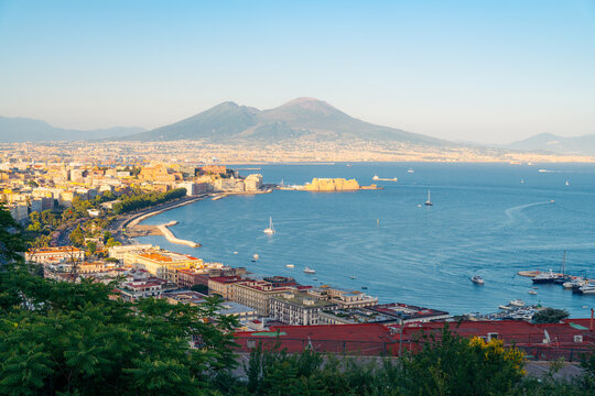 Panoramic view of Naples Italy coastline and bay featuring Mount Vesuvius and city architecture