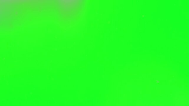 Glitter dust rain falling down smoothly on a green screen layout adding a luxury premium feel to wedding invitations, celebrity awards background, fashion shows, and elite video events professio.