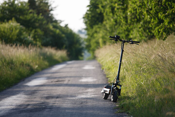 Obraz premium Electric scooter Kukirin in the summer on the way 
