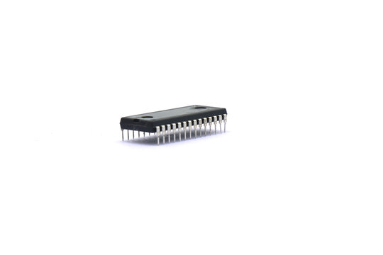 A blurry microcontroller on a white background. An archaic concept of technological advancement.