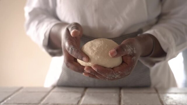 young african woman hands for baking bread or pastry with rolling pin on table in kitchen for recipe concept, homemade food preparation and livelihood and employment in africa