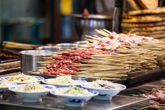 Traditional bowl of noodles and grilled meat skewers served as street food, Xi'an, Shaanxi, China