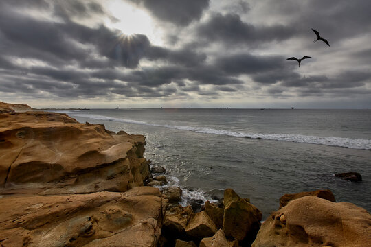 Time carved in stone &mdash; sinuous, wind-sculpted sandstone walls form a dramatic natural corridor along the raw, untamed coastline of Lobitos, Piura, Peru, where millennia of Pacific winds, salt-laden ai