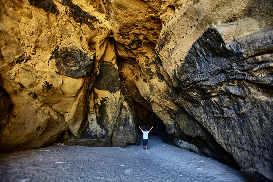 Time carved in stone &mdash; sinuous, wind-sculpted sandstone walls form a dramatic natural corridor along the raw, untamed coastline of Lobitos, Piura, Peru, where millennia of Pacific winds, salt-laden ai