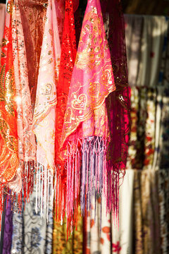 Colorful silk fabrics for sale at local market, Turpan, Xinjiang, China