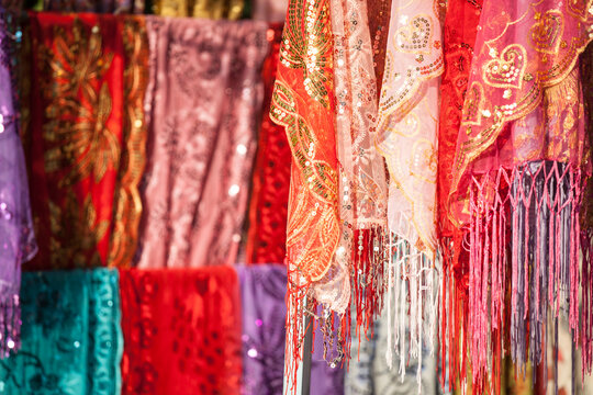 Colorful silk fabrics for sale at local market, Turpan, Xinjiang, China
