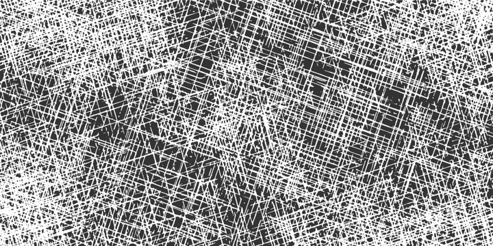 Dense crisscrossing white lines forming a chaotic abstract pattern on a dark gray background texture