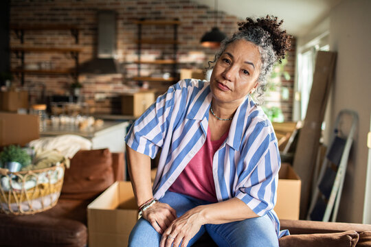 Portrait of a senior woman after unpacking boxes in her new home 