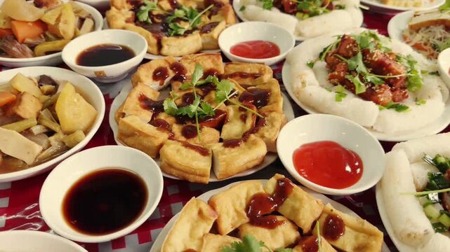 Traditional Vietnamese food spread with fried tofu and spring rolls, authentic Asian cuisine banquet, assorted oriental dishes on dinner table