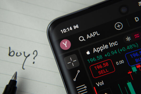 Dhaka, Bangladesh- 20 June 2025: Apple Inc stock trading details displayed on smartphone with handwritten note.