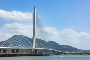 Fototapeta premium Danjiang Bridge in Tamsui Taiwan with blue sky
