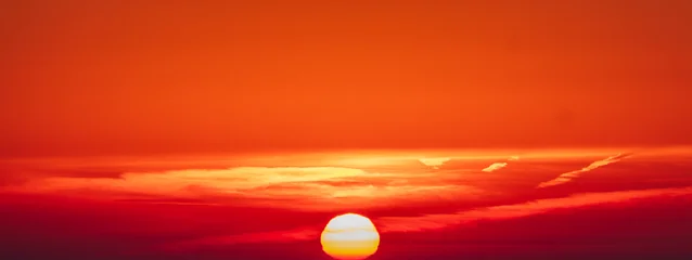 Fototapeten Rot Sky replacement large yellow ball sun and deep orange sky at sunset  © Mary Struck