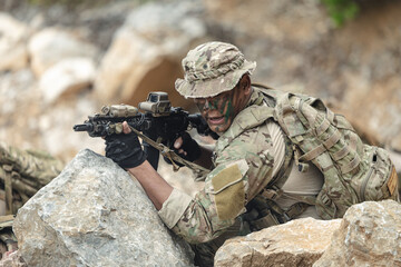 Naklejka premium US Marine, Military Special forces soldier under heavy enemy fire intense battlefield engagement