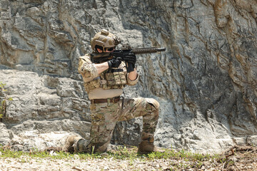 Naklejka premium US Special forces soldiers engaged in combat operation, tactical military team in action