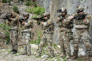 Naklejka premium Military special forces soldier team in combat operation, tactical military portrait in action
