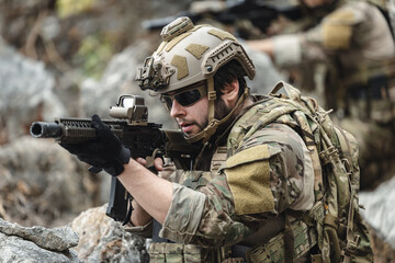 Fototapeta premium US Marine, Military Special forces soldier under heavy enemy fire intense battlefield engagement