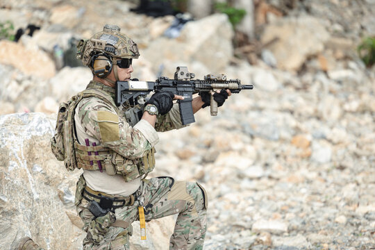 US Special forces soldiers engaged in combat operation, tactical military team in action