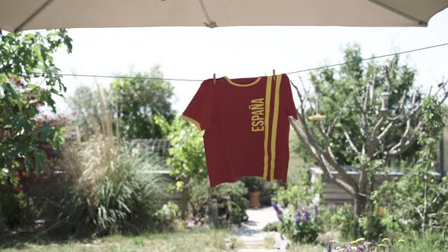 Spanish sports fan t-shirt hanging in garden ready for the next football match
