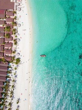 Aerial Drone View of Koh Lipe Island Beach with Turquoise Water and Longtail Boats, Thailand