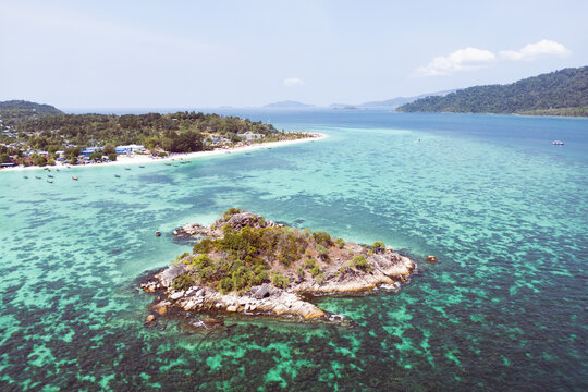 Aerial Drone View of Koh Lipe Island Beach with Turquoise Water and Longtail Boats, Thailand