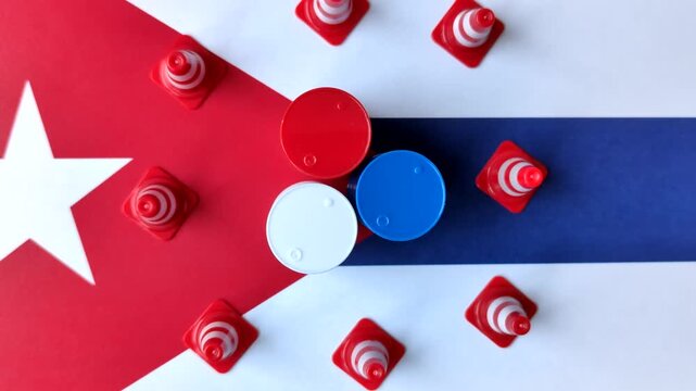 The cargo container ban on the Cuba flag as a conceptual backdrop for the export and logistics of goods. The cargo container embargo on the Cuban flag as a backdrop for your design