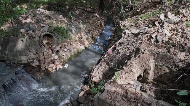 View shows a Overflowing drain Surpassing Debris Filled Area with Stagnant Water