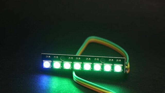 Programmable ARGB LED strip displaying colorful light patterns controlled by a micro controller