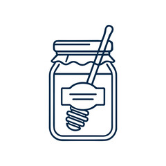 Honey jar with a spoon. © Melinda